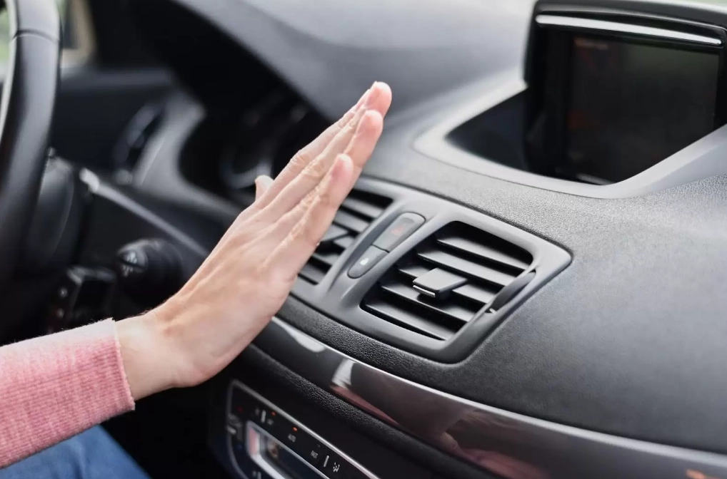 car ac blowing warm air